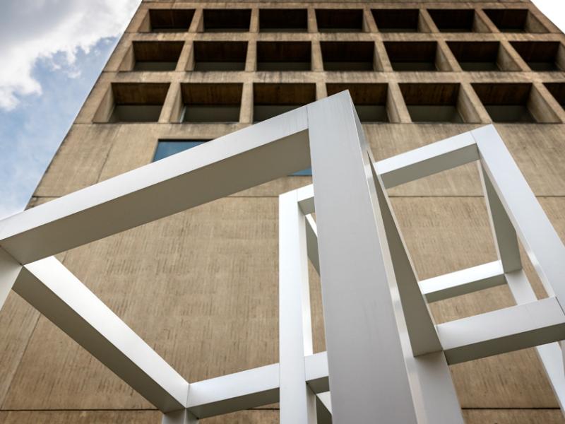 A sculpture by Sol LeWitt in front of the Herbert F. Johnson Museum of Art.
